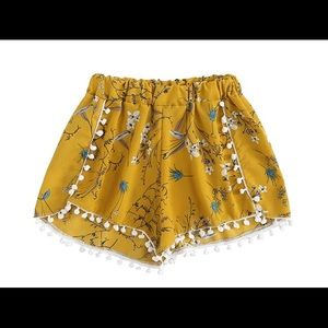 Yellow floral flowy shorts with tassels. NWT!